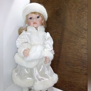 Elegant White Porcelain Doll with Fur Accents